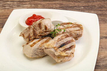 Grilled pork tenderlion with tomato sauce