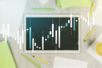 Multi exposure of abstract financial diagram and modern digital tablet on background, banking and accounting concept