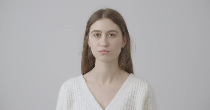 beautiful girl with green eyes tears off her face mask symbolizing overcoming the pandemic of humanity. Stop covid-19