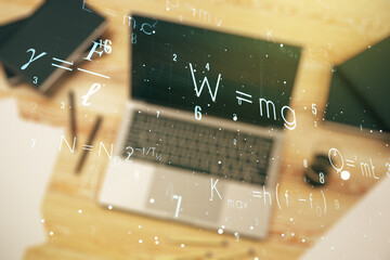 Double exposure of creative scientific formula concept on laptop background, research and...