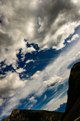 dark blue sky with black gray clouds clear and sharp as a background Fanealm und Wilder See in Suedtirol, Italy, Mountain with blue sky 