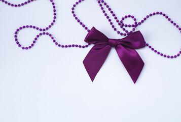 Top view(flat spoon) of a purple bow isolated on a white background. copy the space.