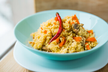 hot pilaf with carrot and chicken