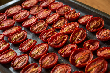 Cooking sun-dried tomatoes in the oven in the kitchen