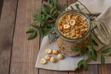 glass jar with homemade muesli with nuts. Healthy breakfast.