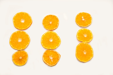 Slices of orange isolated on white background. Flat lay, top view