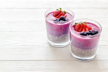 Homemade yogurt chia seeds pudding with strawberries in glasses