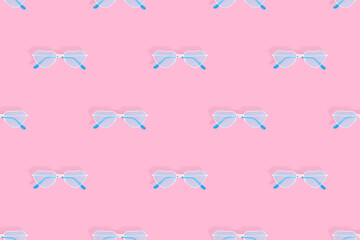 Glasses seamless pattern. Eyeglasses with heart-shaped lenses. 