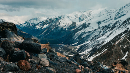 rocky landscape with snowy mountains 