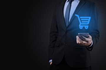 Businessman man holding shopping cart trolley mini cart in business digital payment interface.Business, commerce and shopping concept