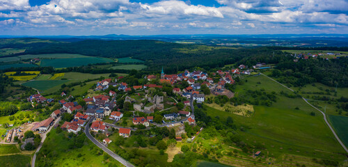 Aerial view of the village and castle Altenstein close to Maroldsweisach in Germany on a sunny day in spring.	