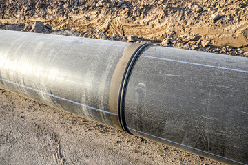 Weld seam of a large diameter plastic pipe close-up.
