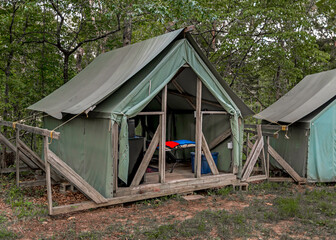 Summer Camp Tent with flaps open, Wall tents in forest clearing