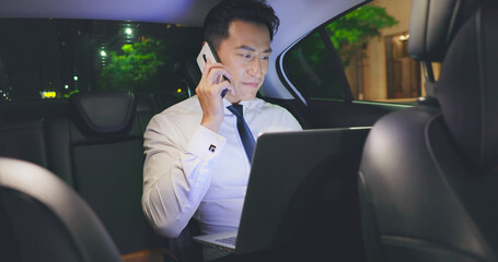 businessman work in car