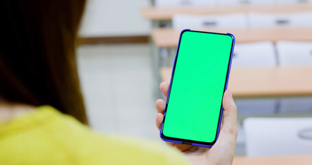 woman use green screen smartphone
