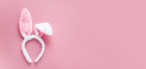 bunny ears headband happy easter on pink  background with copy space horizontal banner for your design 