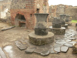 Ruins of an ancient Roman bakery in Pompeii, Italy