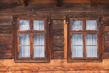 Obraz na płótnie Canvas Two wooden windows from an old wood house