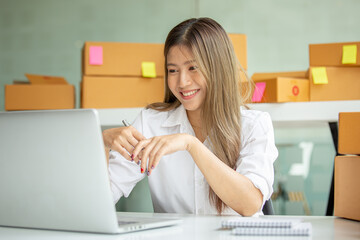 Fototapeta na wymiar Portrait of young business asian woman online working in office desk use computer copyspace. Success business people employee, freelance SME online marketing work at home, coworking space concept