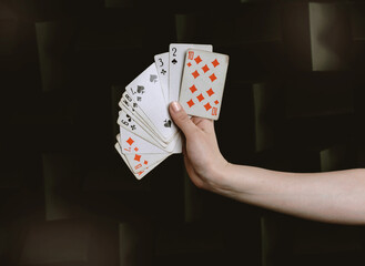 a deck of cards in your hand