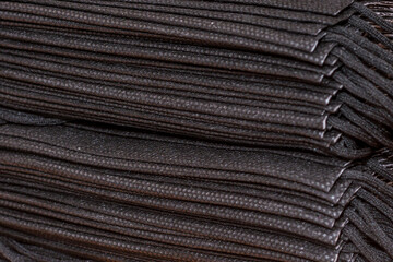 Pile of black face masks - medical concept background.Close up.