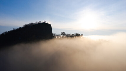 Amazing geological formatoion with fog. Basalt columns hill in upper Balaton region in Hungary. The...