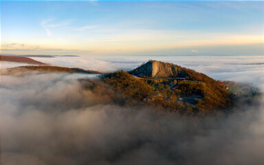 Amazing geological formatoion with fog. Basalt columns hill in upper Balaton region in Hungary. The hungarian name is Hegyesstu.