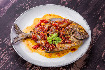 Deep fried pomfret fish and chili sauce