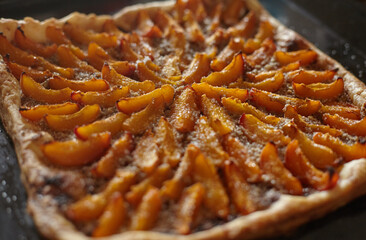 cooking a very tasty apricot pie with nuts