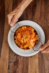 Patatas bravas, Spanish dish with fried potato and a spicy ali oli sauce.