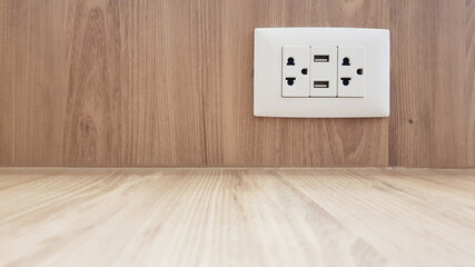 Public USB charger and power outlets on wooden table