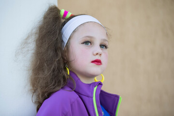 Little girl with bright makeup in retro style. Child model.