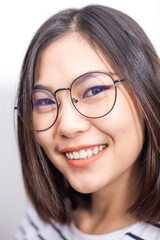 Beautiful asian glasses short hair women smiling face close up