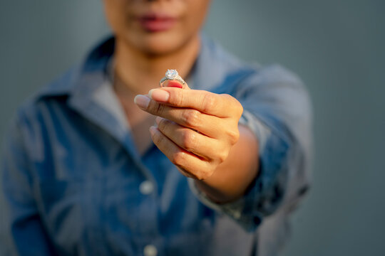 Sad Wife Take off the diamond wedding ring from finger. Quarrel fight of breakup Conflict, bad relationships. Depressed female suffer  Major Depressive Disorder Problem from Dysfunctional Family