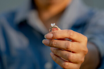 Sad Wife Take off the diamond wedding ring from finger. Quarrel fight of breakup Conflict, bad...