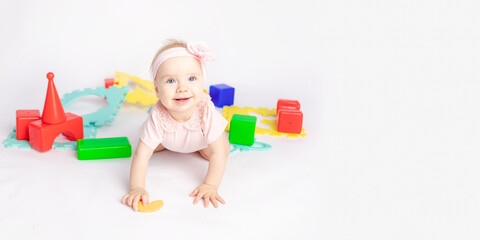 Naklejka premium the kid plays with cubes on a white isolated background, space for text, banner