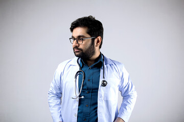 A sad doctor wearing stethoscope and medical coat