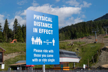 View of Whistler Village Gondola entrance with sign Physical Distance in Effect