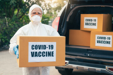 health worker transporting COVID-19 vaccine 