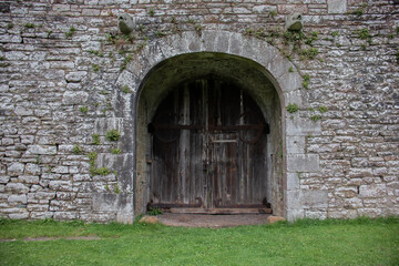 Old wooden door entrance to castle.
