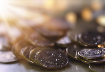 coins rubled in the rays of the sun background