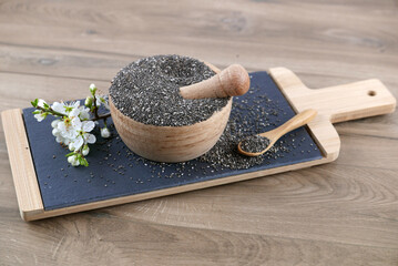 Chia seeds in a wooden mortar