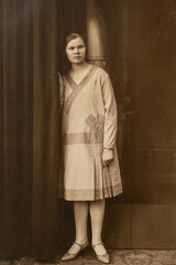 Germany - CIRCA 1930s: Portrait of young woman standing in studio, Vintage Carte de Viste Art Deco era photo