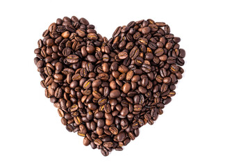 Heart-shaped coffee beans. Roasted, aromatic coffee beans on a white background. Isolate. Concept of Valentine's day or coffee lover's. Soft focus.