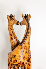 wooden giraffe statue. giraffes on white background