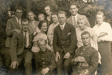 Latvia - CIRCA 1920s: Group photo of party guests. Some men in uniform. Vintage historical archive...