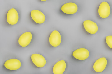 Stylish background with yellow easter eggs isolated on gray background. Flat lay, top view, mockup, overhead, template