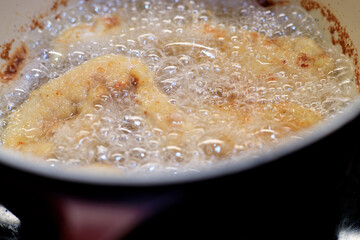 Fish fillet frying in boiled oil