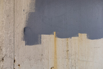 Grey oil paint on the wall at street
