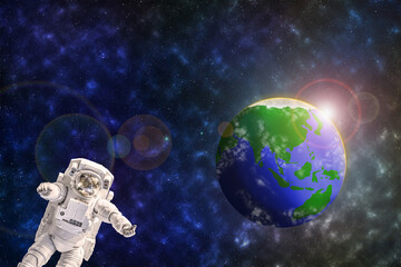 Obraz na płótnie Canvas Statue or plastic model astronaut or spaceman floating in colorful space galaxy with earth or blue green planet and fair light form sun background